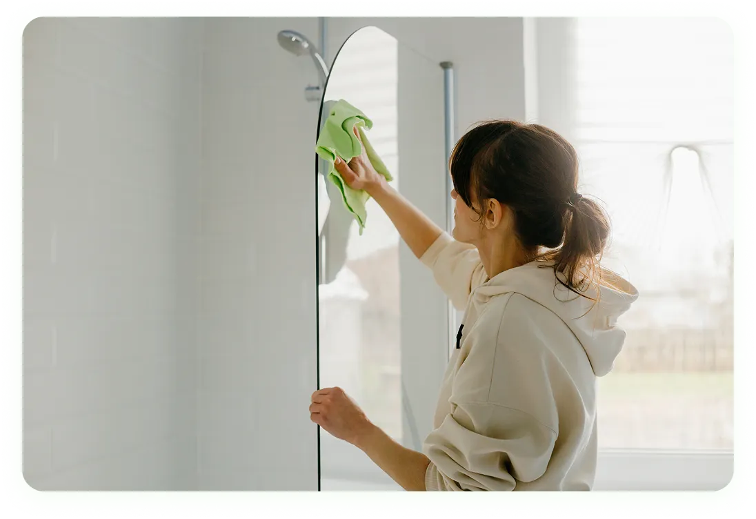 A household help cleaning windows